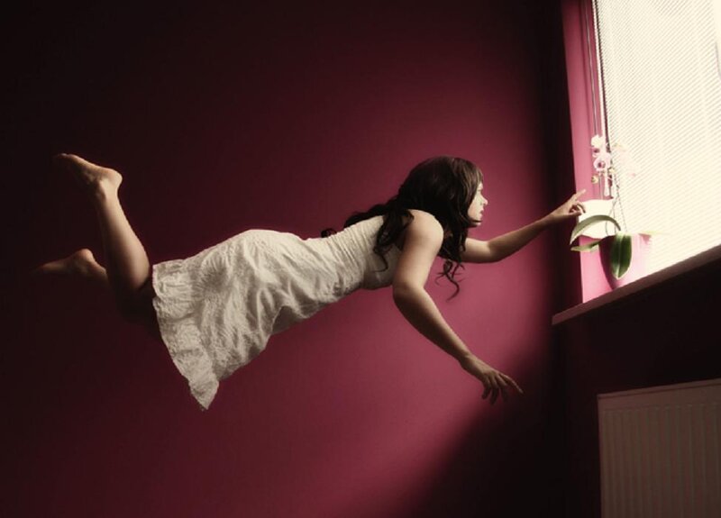 Woman Floating in Room — Maroon