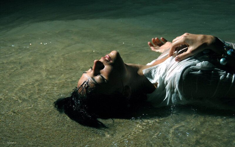 woman floating in shallow water