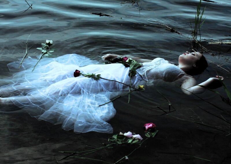 Woman Floating in Water — Blue, Dramatic, Photograph