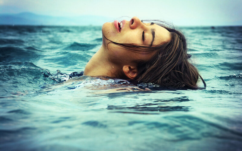 Woman Floating in Water — Blue, Serene, Photograph, Ocean
