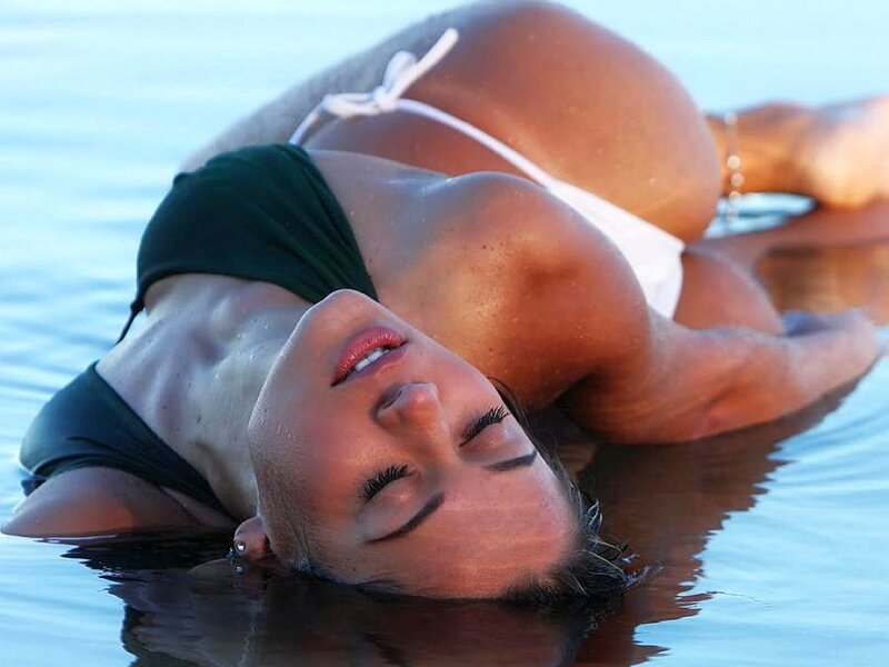 Woman Floating in Water — Blue, Serene, Sunset