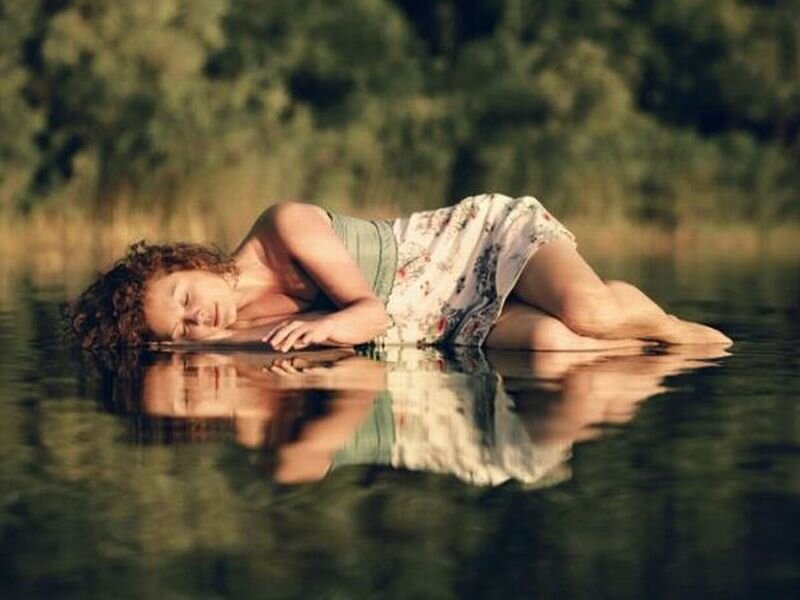 Woman Floating in Water — Green, Serene, Afternoon, Photograph