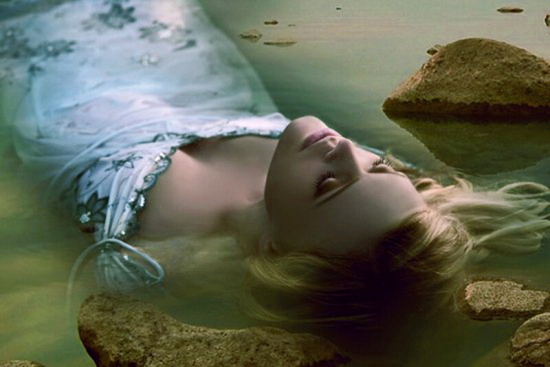 Woman Floating in Water — Green, Serene, Photograph