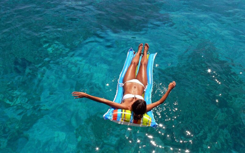Woman Floating on Raft