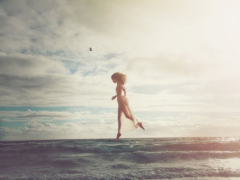 Woman Floating over Ocean — Blue