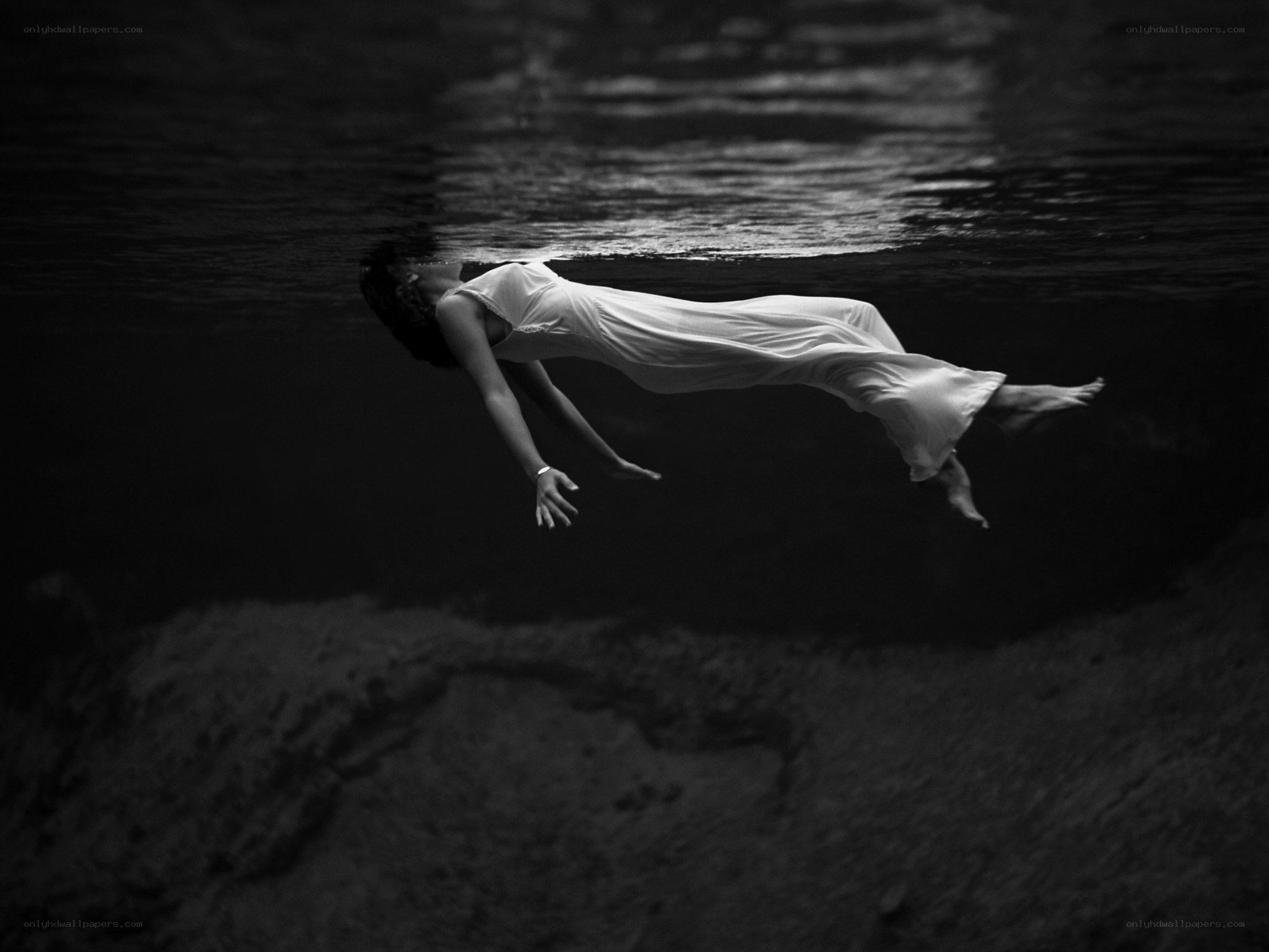 woman floating underwater