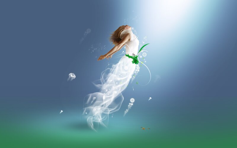 woman floating underwater