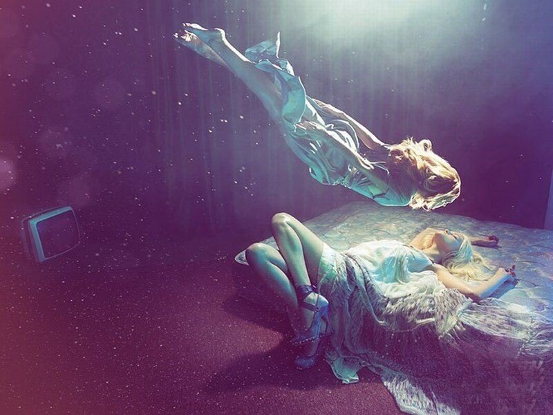 woman floating underwater