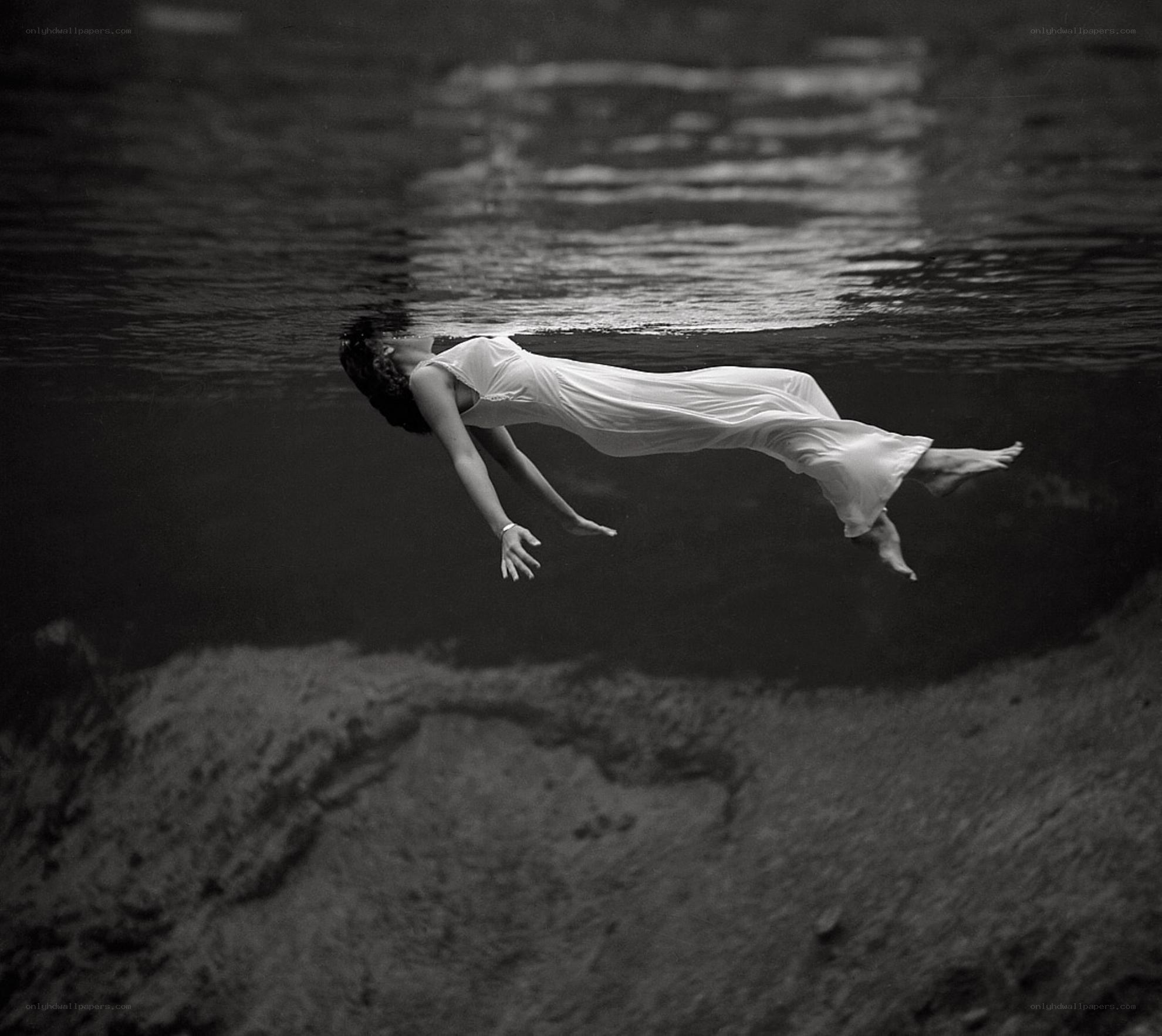 woman floating underwater