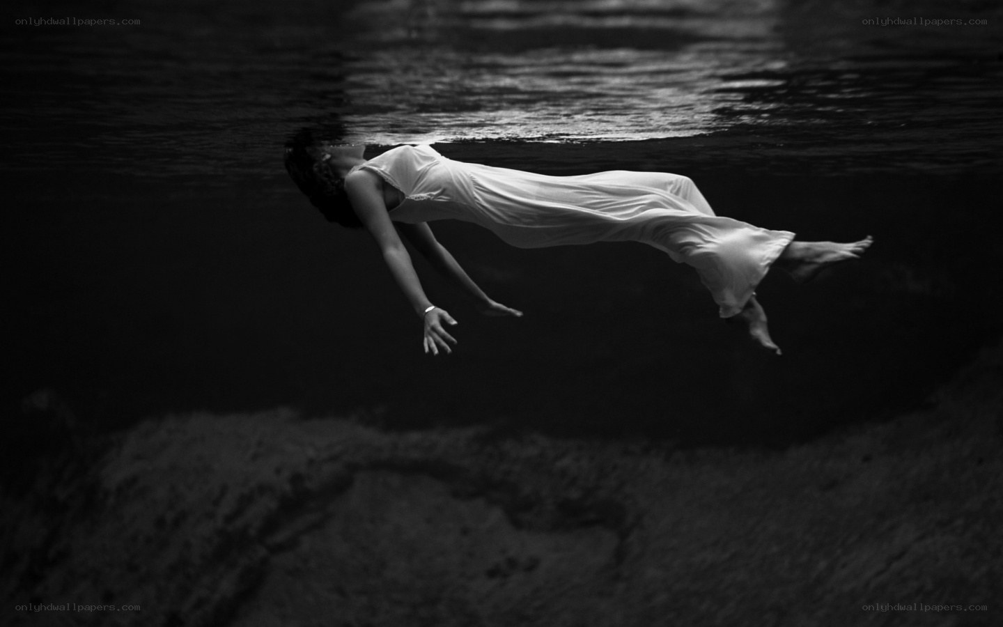 woman floating underwater