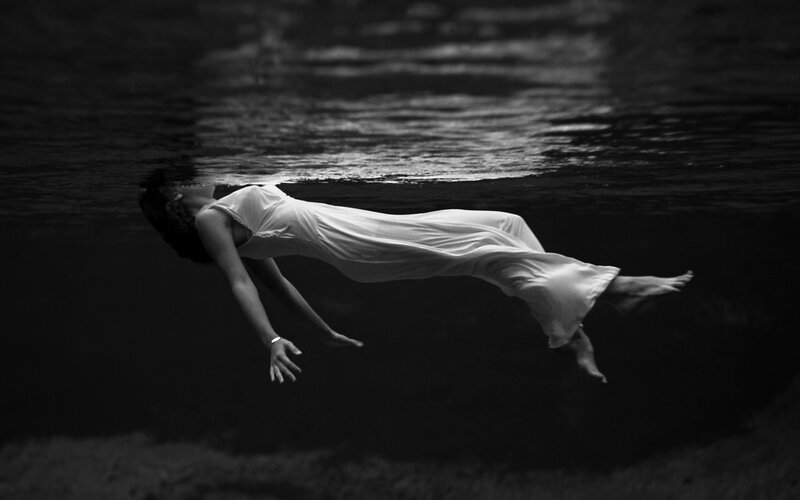 Woman Floating Underwater — Black, Serene
