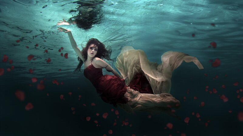Woman Floating Underwater — Red