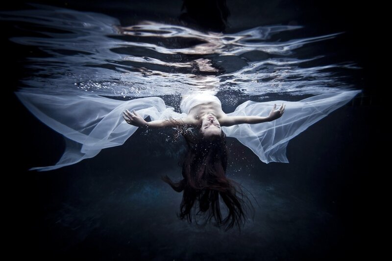 Woman Floating Underwater — White