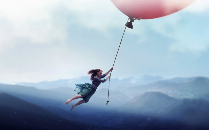 Woman Floating with Balloon