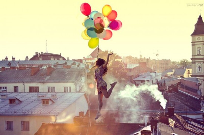 Woman Floating with Balloons — Yellow