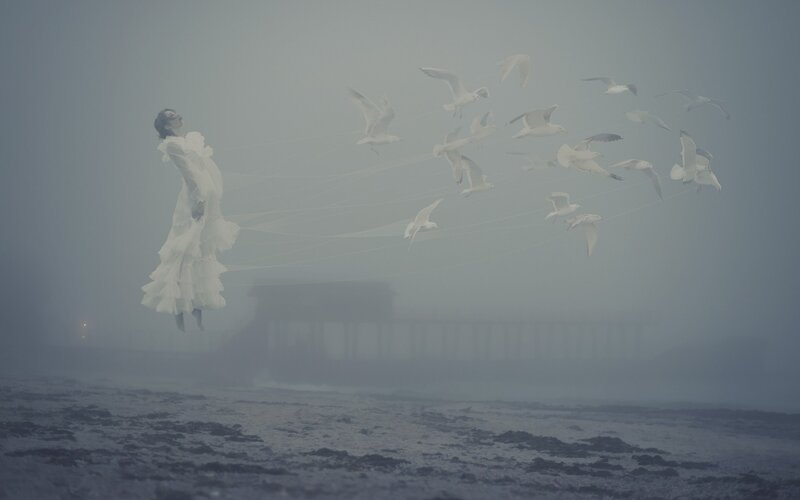 Woman Floating with Birds
