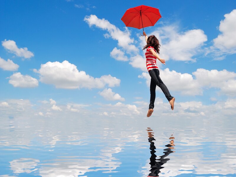 Woman Floating with Umbrella