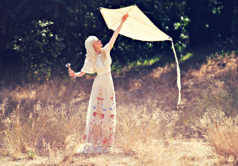 Woman Flying Kite — Beige