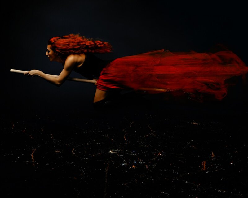 woman flying on a broom
