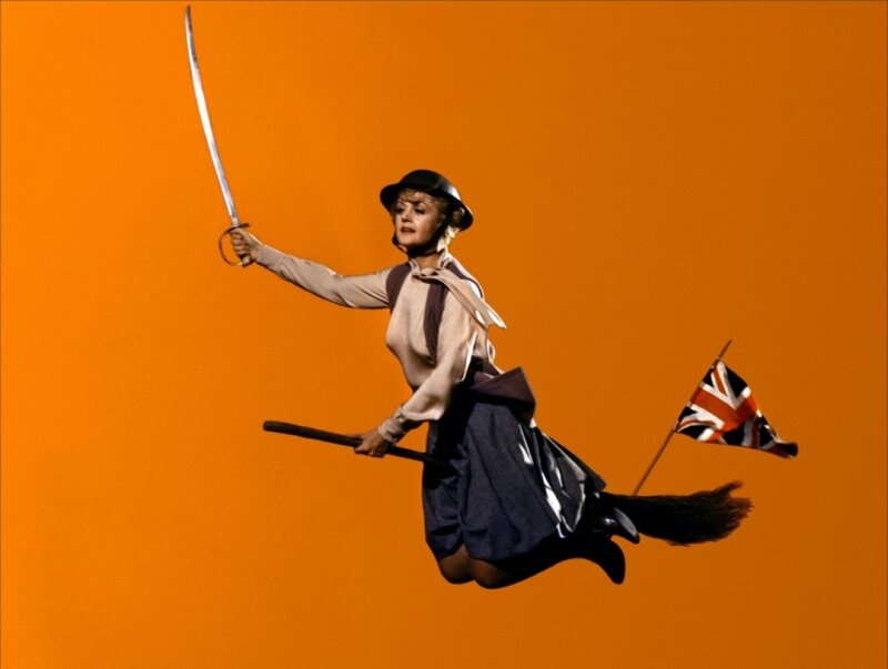 woman flying on broomstick
