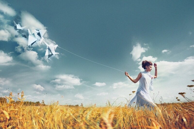 Woman Flying Paper Kites