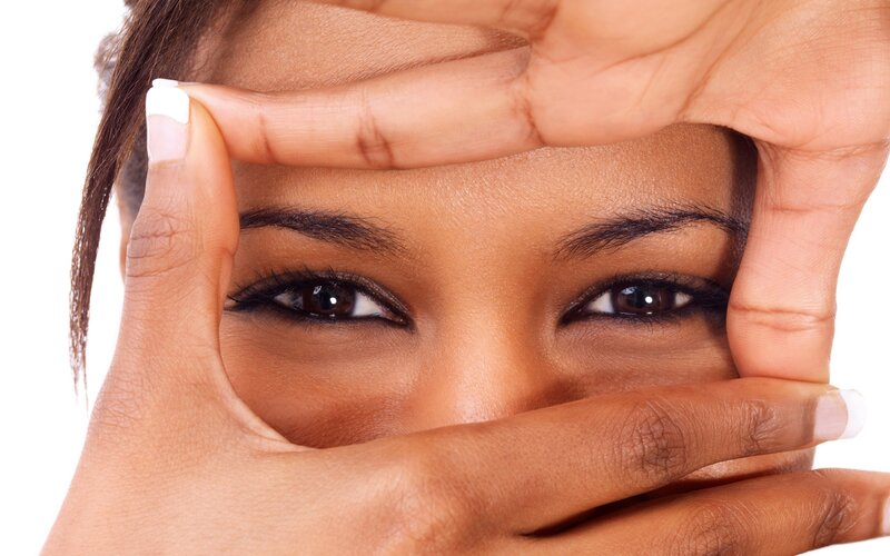 woman framing her eyes