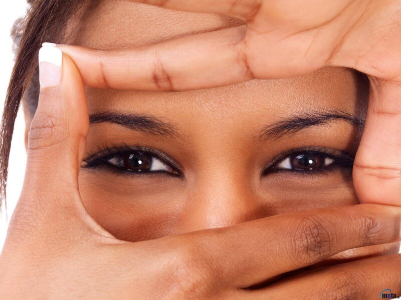 woman framing her eyes