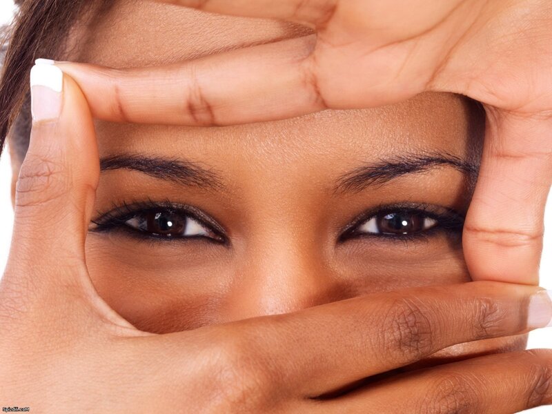 woman framing her eyes