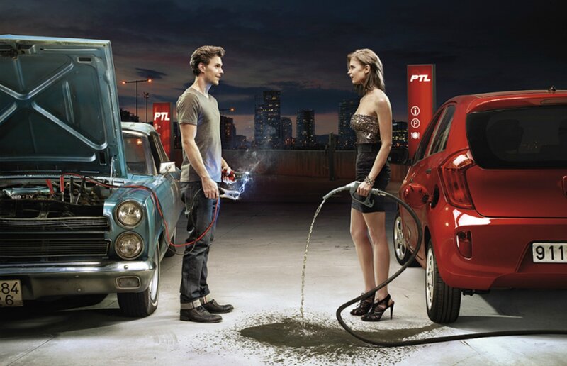 Woman Fueling Car