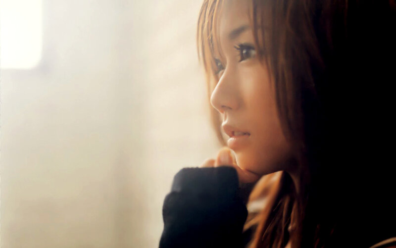 woman gazing out window