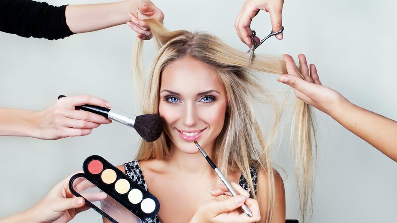 woman getting hair and makeup
