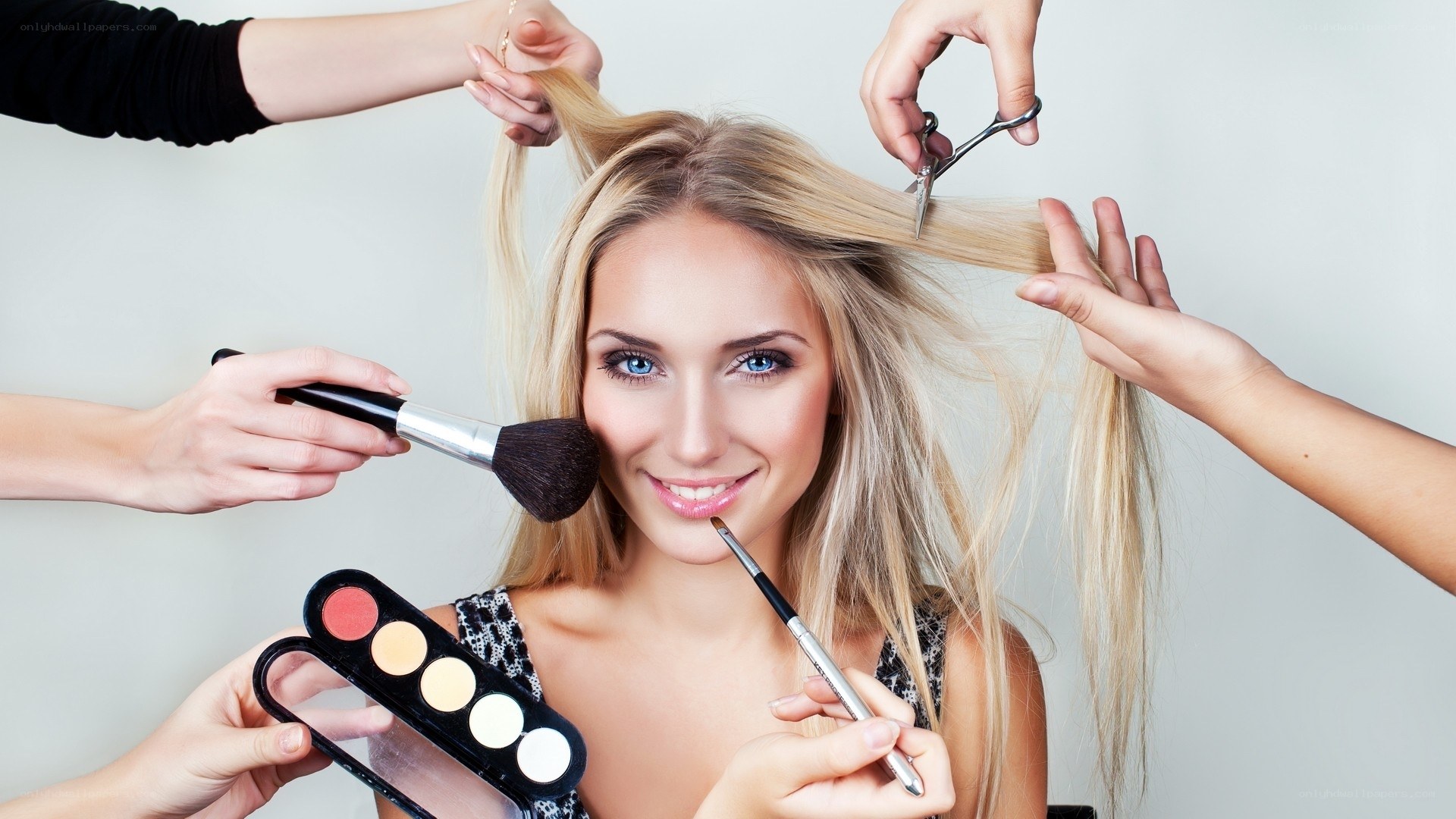 woman getting hair and makeup