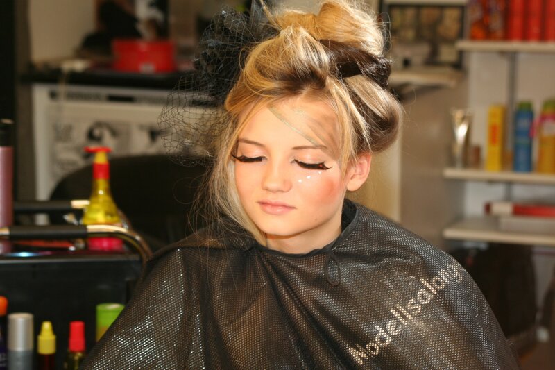 woman getting hair styled