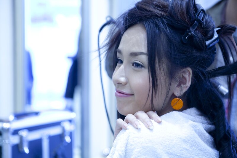 woman getting hair styled