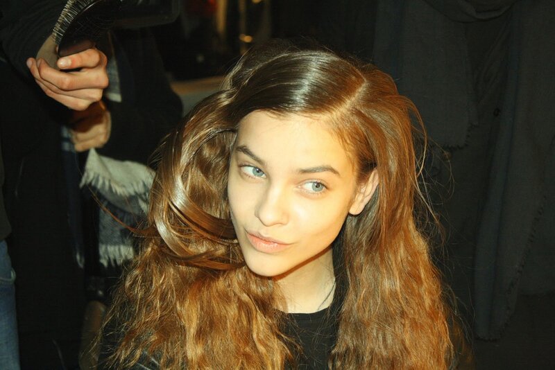 woman getting hair styled