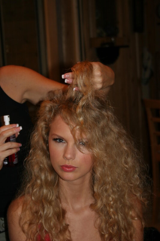 woman getting hair styled