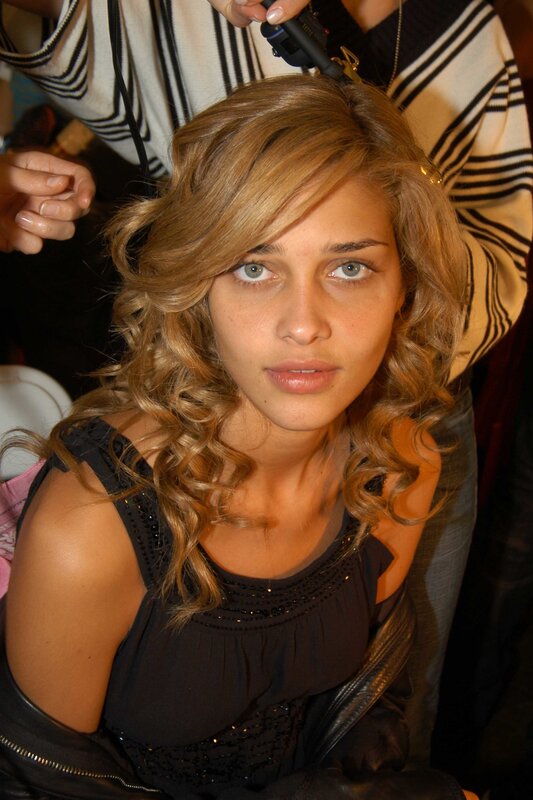 Woman Getting Hair Styled — Brown