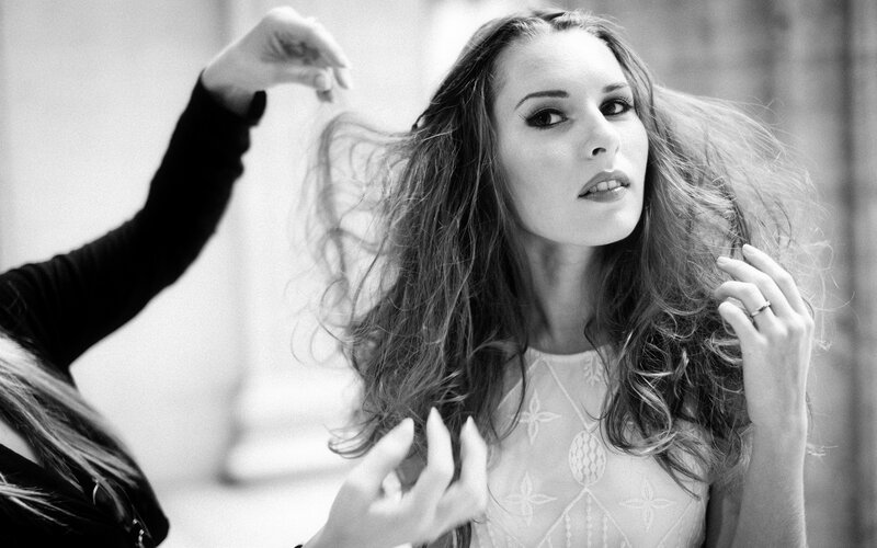 woman getting her hair styled