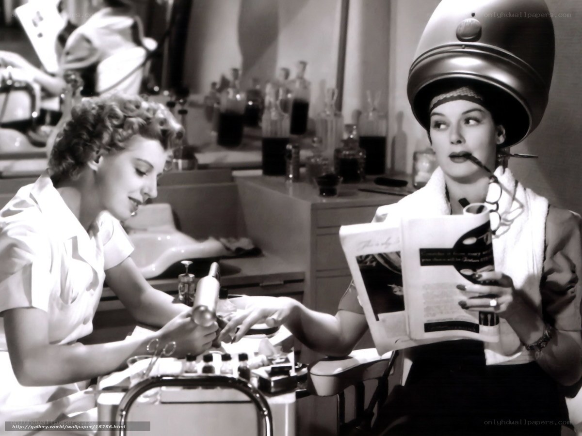 Woman getting manicure at salon
