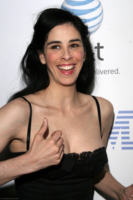 woman giving thumbs up at event