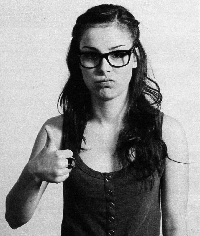 woman giving thumbs-up gesture