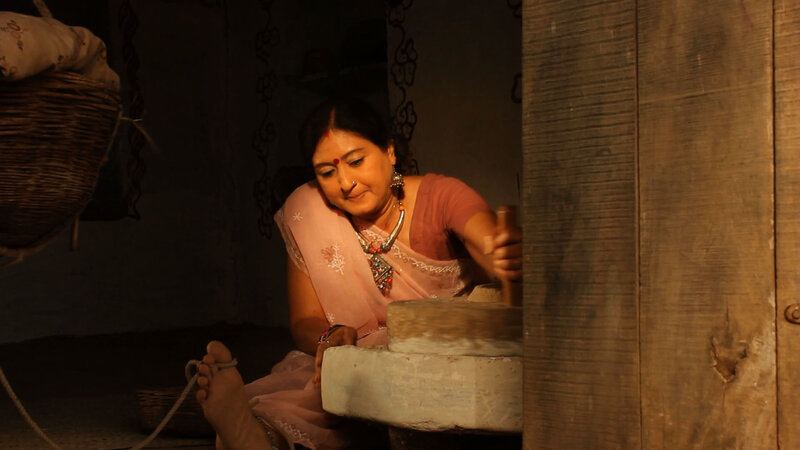 Woman Grinding Grain