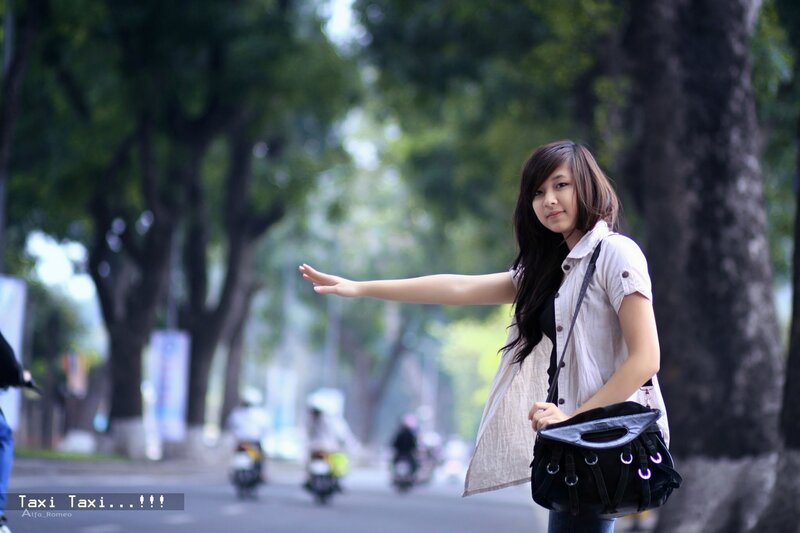 Woman hailing a taxi