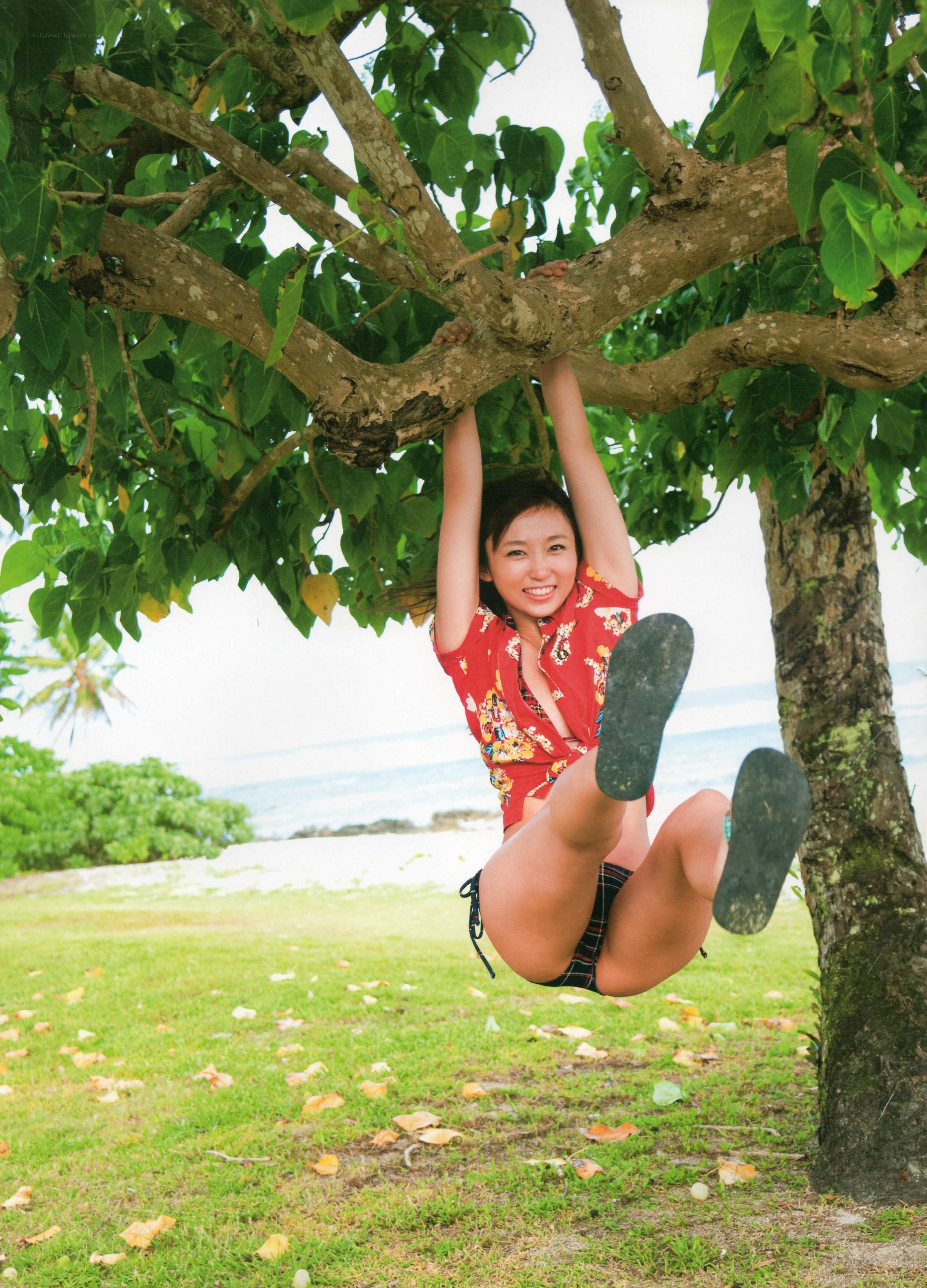 Woman hanging from a tree