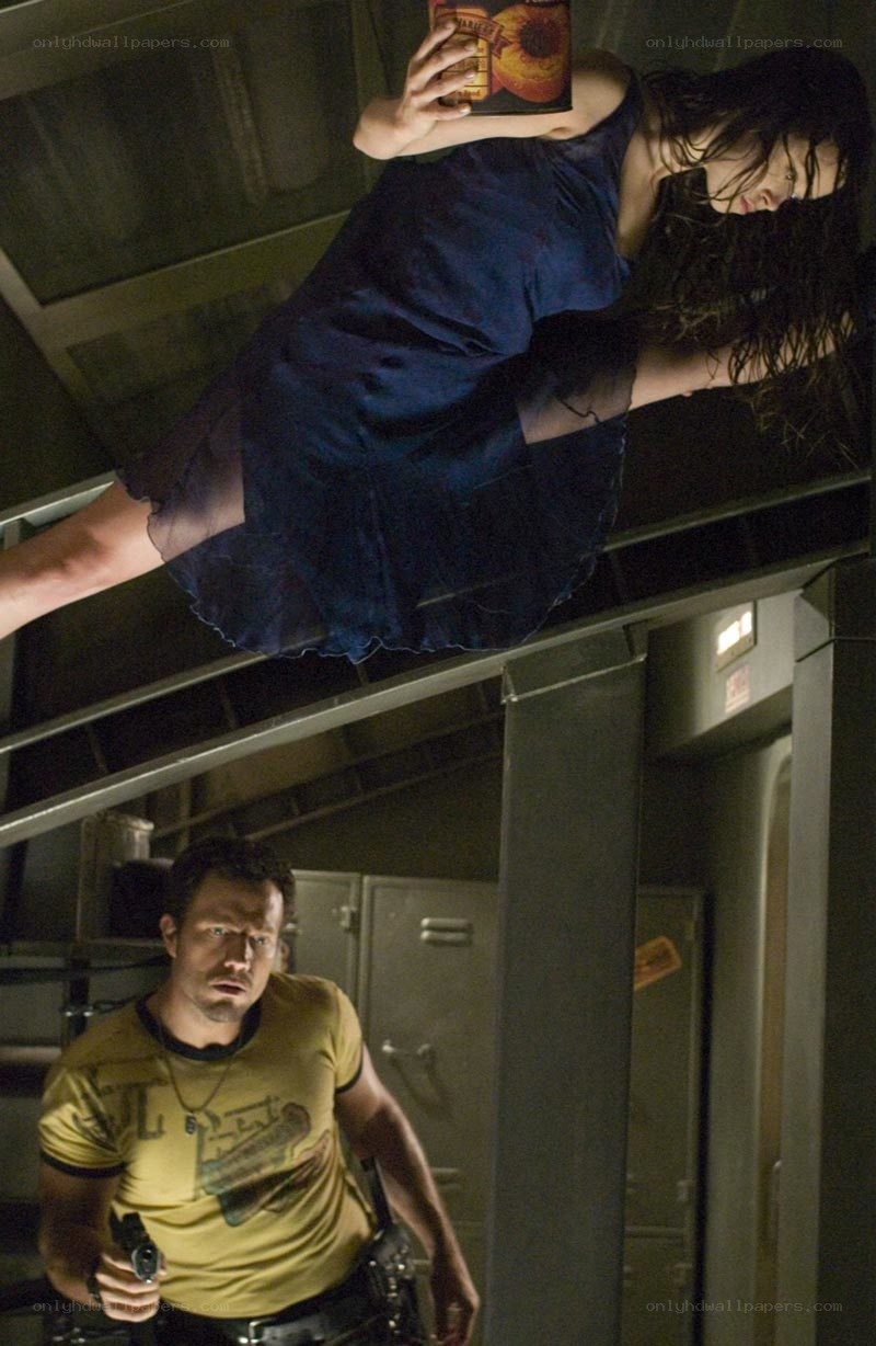 Woman hanging upside down with book