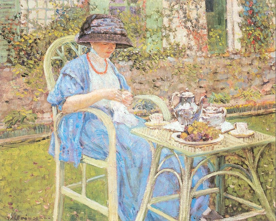 Woman having tea in garden