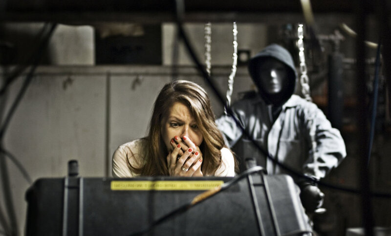 Woman Hiding from Masked Person