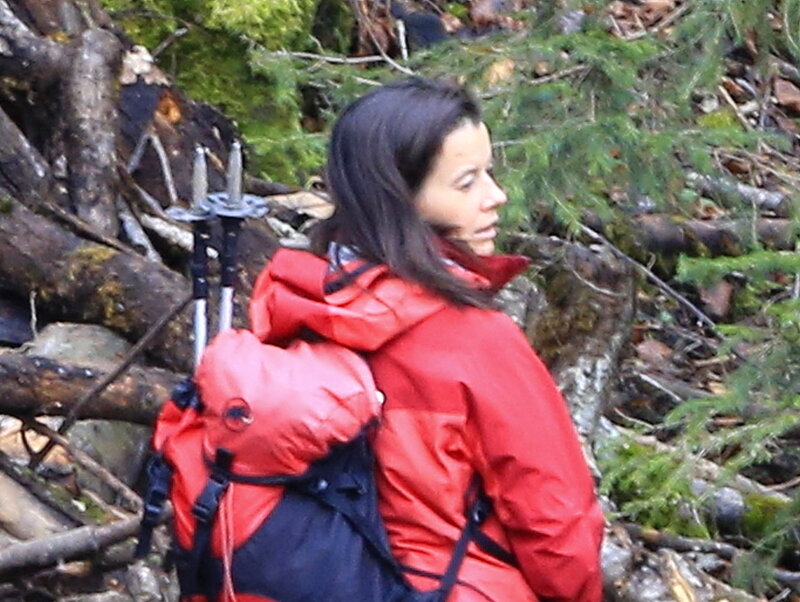 Woman Hiking in Forest — Red