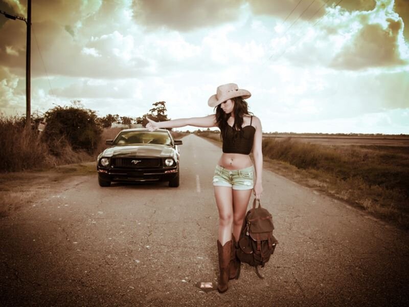 Woman Hitchhiking on Road — Brown, Dramatic