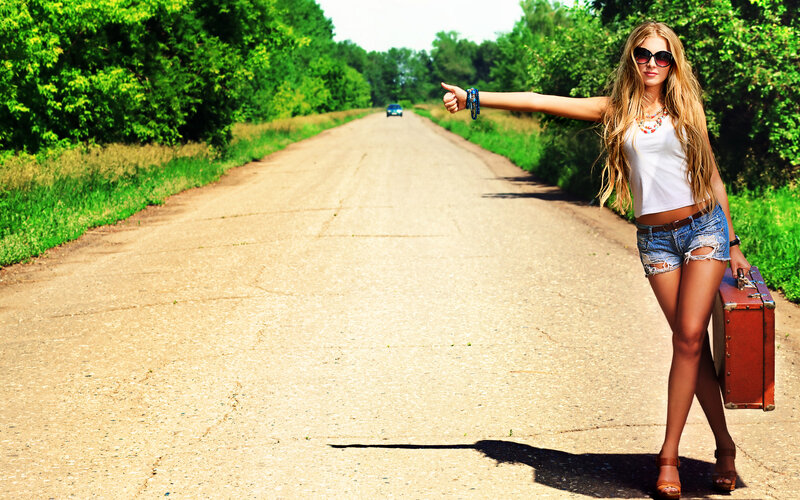 Woman Hitchhiking on Road — Green